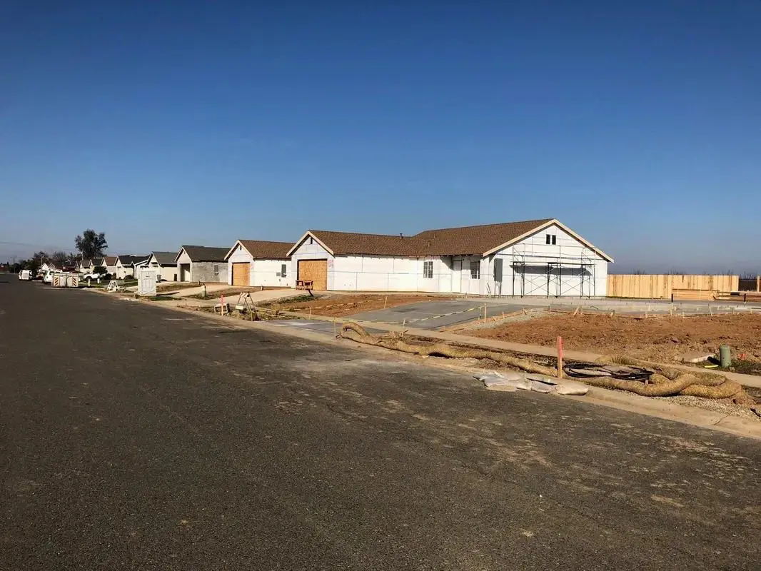 A row of homes under construction in california.