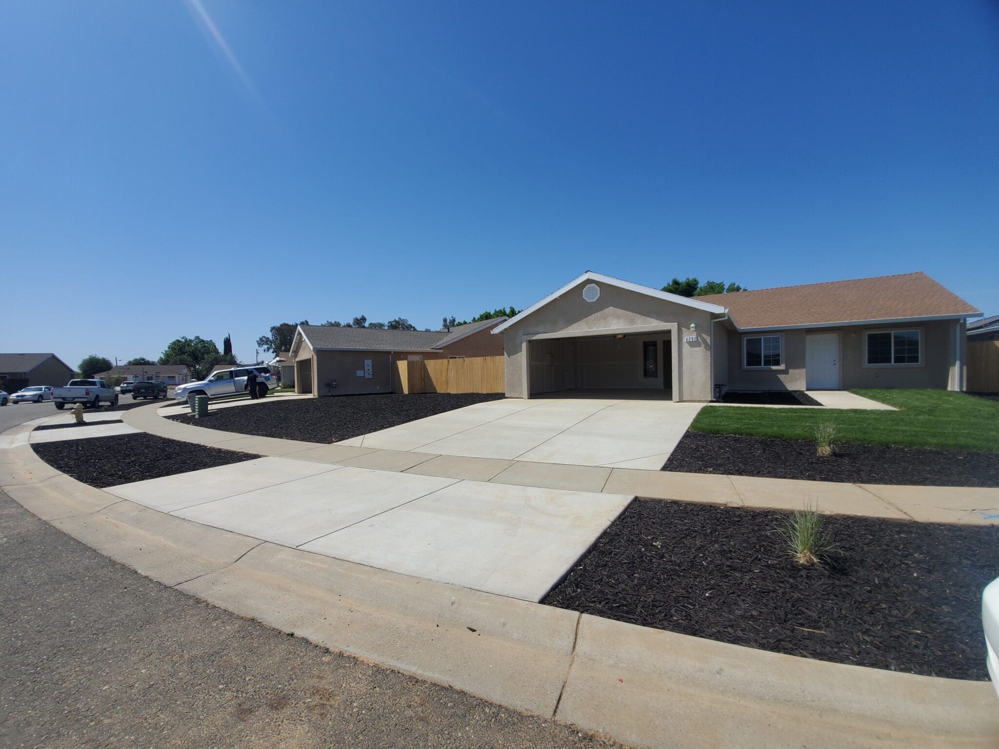 A house with a driveway in front of it.