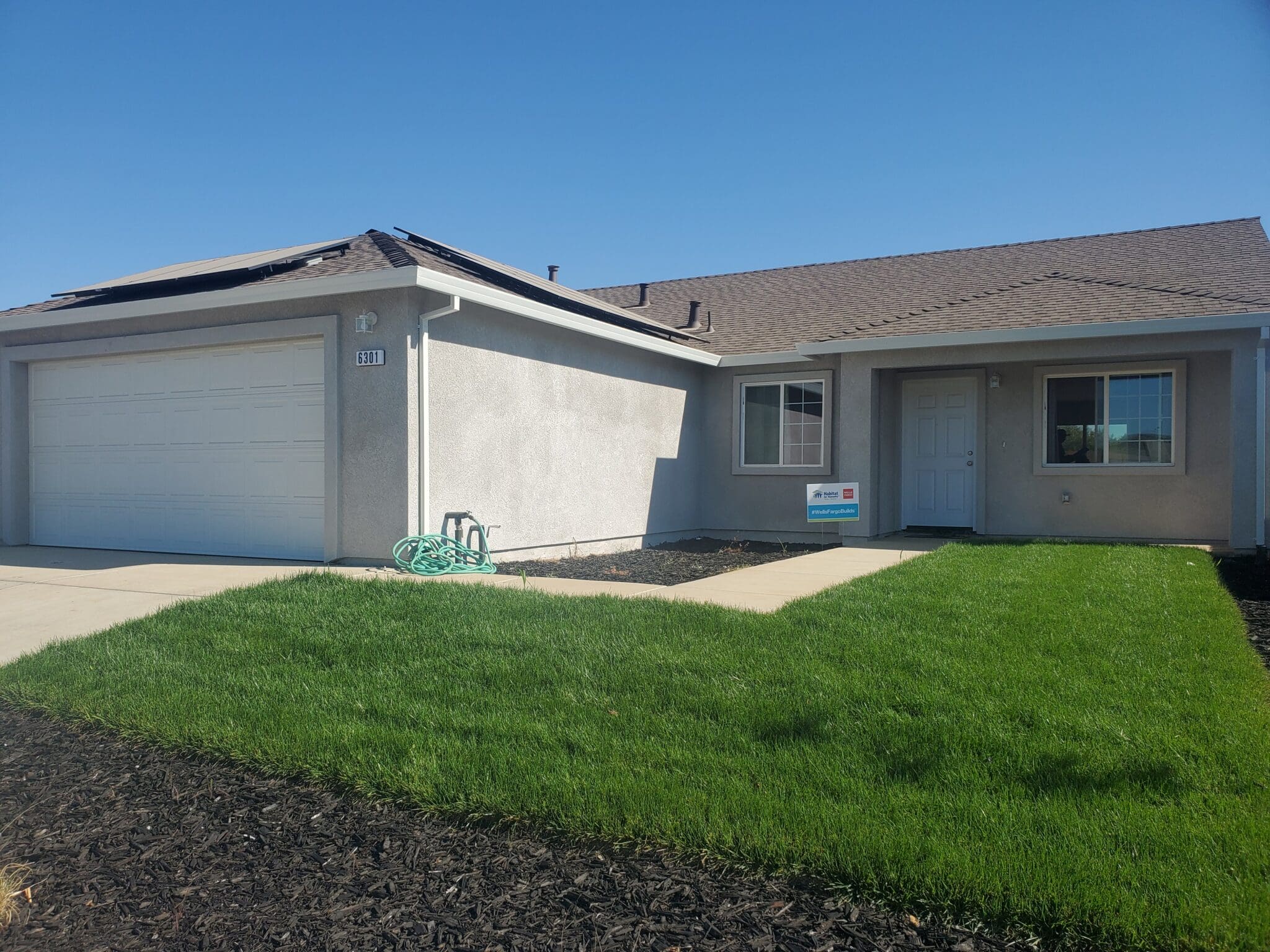 A house with grass in front of it.