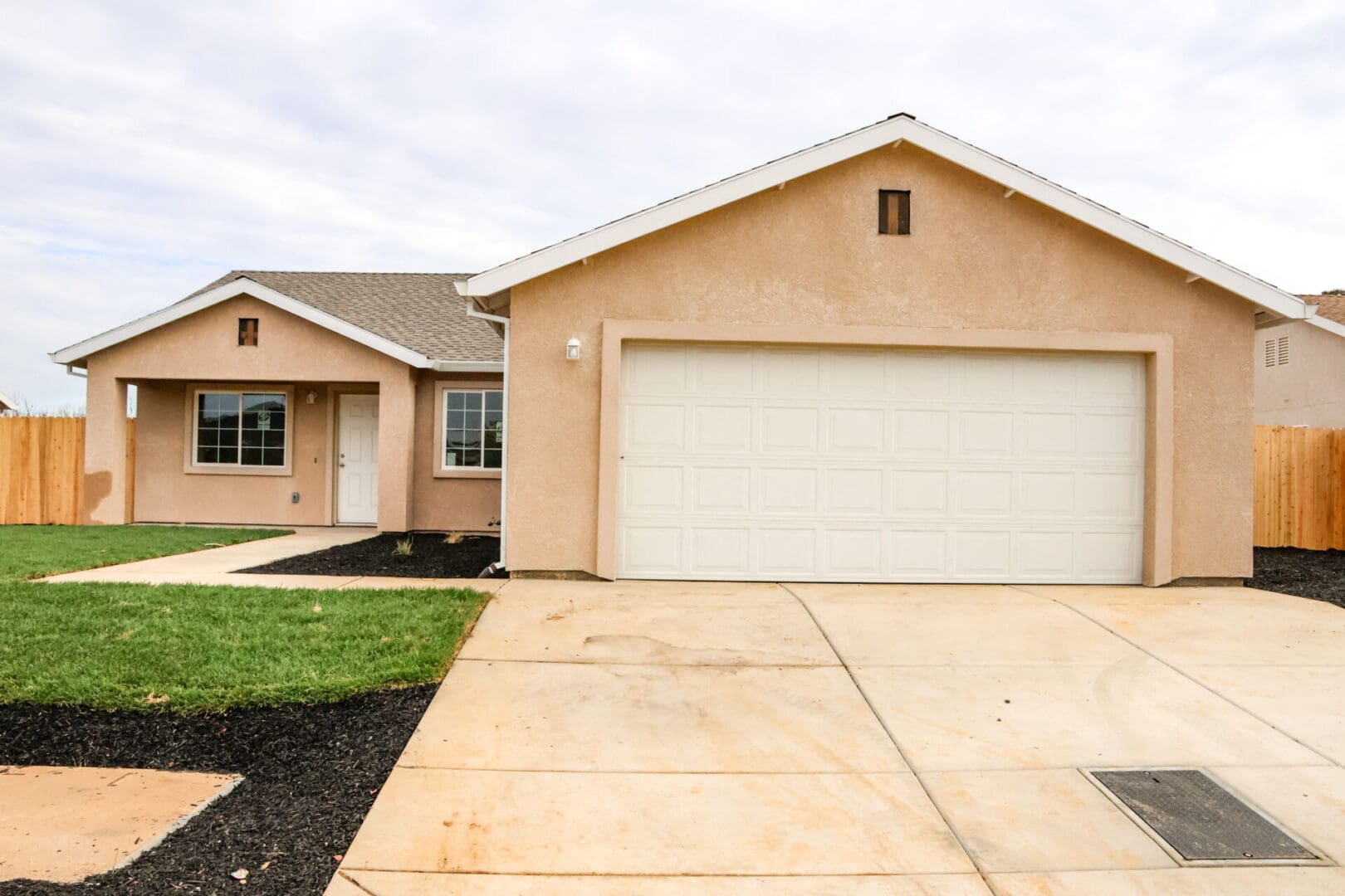 A home with a garage and a driveway.