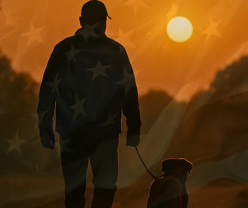 Man walking dog at sunset, American flag.